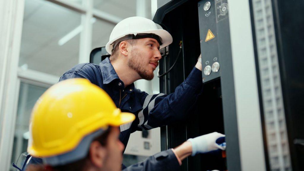 machine-maintenance image of maintenance technicians performing alignment and calibration testing